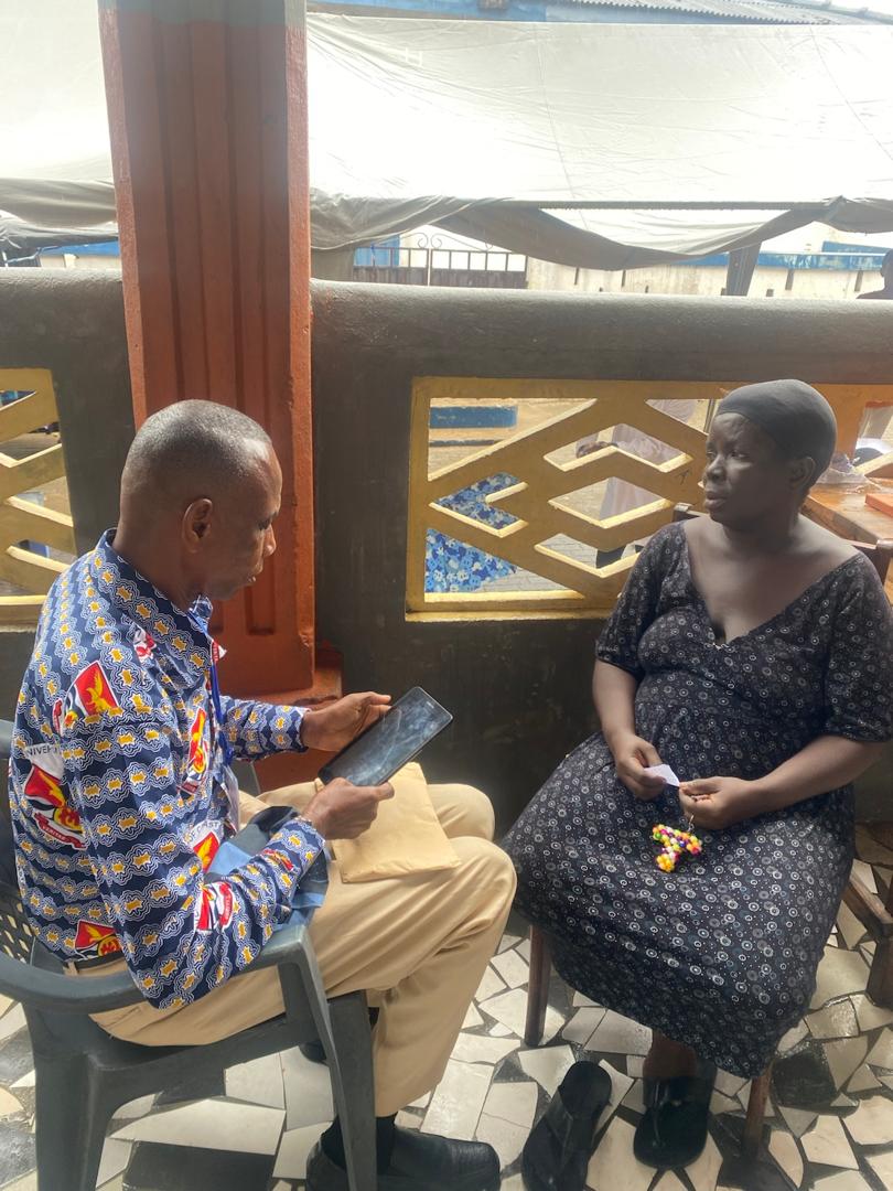 A research team member conducting a community interview during fieldwork
