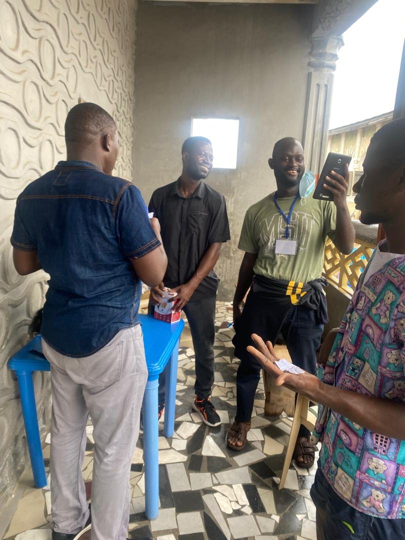 Research team members reviewing data collection materials on-site