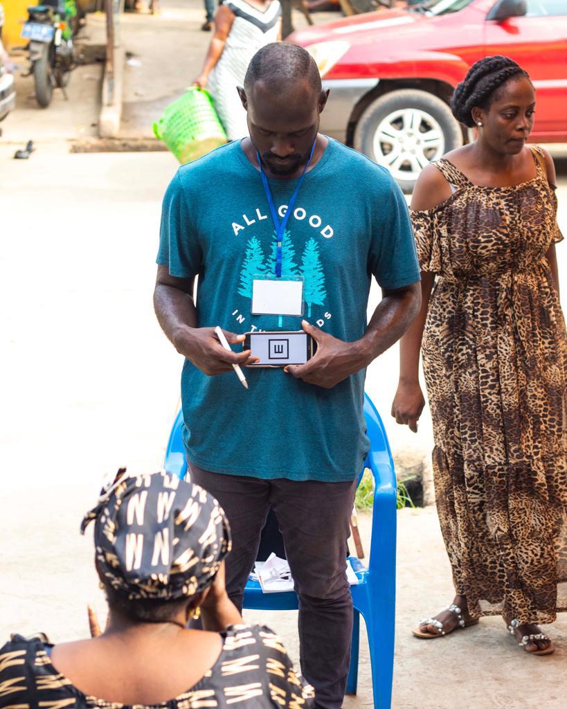 A research team member documenting a community engagement session